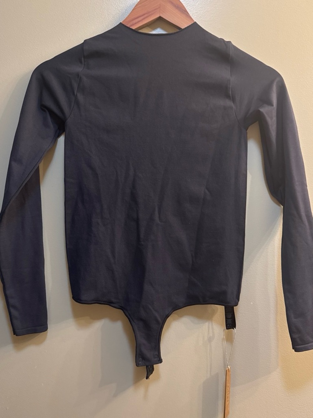 SKIMS Black Essential Bodysuit Tag Photo